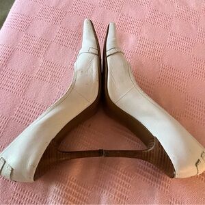 White pumps with embellishments